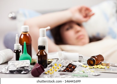 Adult Woman Patient With High Temperature Lying Down Bed For Cold And Flu Illness Relief