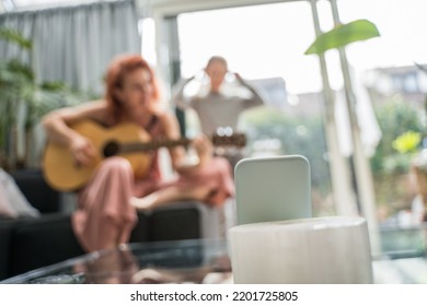 Adult Woman Playing Guitar For Her Child Girl While Recording Video For Tik Tok