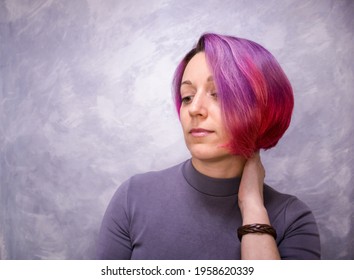 Adult woman portrait and multicolored hair wall background  Creative short asymmetrical haircut  violet   fuchsia pink dye  Trendy colored hairstyle  beauty salon  millennials new middle age 