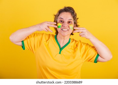 Adult Adult Woman, Soccer Fan From Brazil, Putting Paint On Her Face, Brazilian Fans. Painted Face.