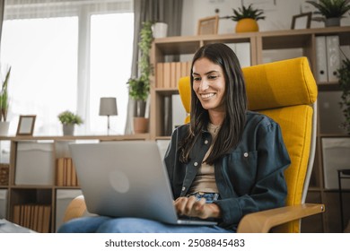 Adult young caucasian woman work from home and use laptop - Powered by Shutterstock