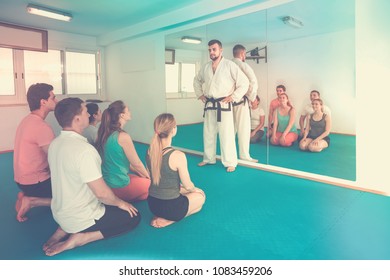 Adults Enjoying Their Trainings With Coach At Karate Class