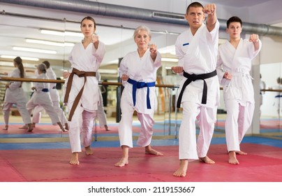 Adults In Kimono Trying New Martial Moves At Karate Class