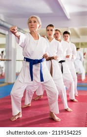 Adults In Kimono Trying New Martial Moves At Karate Class