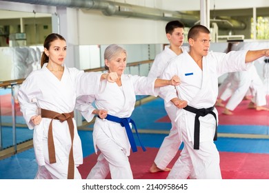 Adults In Kimono Trying New Martial Moves At Karate Class