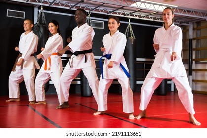 Adults In Kimono Trying New Martial Moves At Karate Class