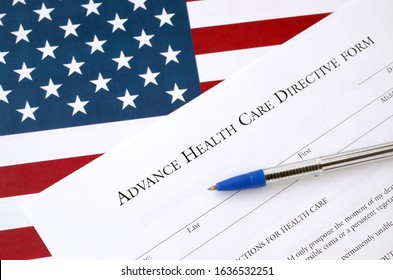 Advance Health Care Directive Blank Form And Blue Pen On United States Flag