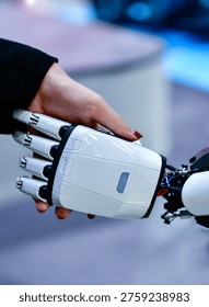 Advanced bionic robotic hand shaking hands with human, symbolizing AI and human collaboration.