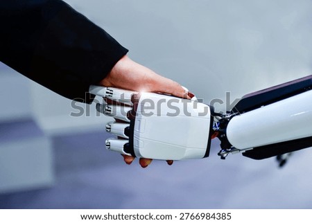 Advanced bionic robotic hand shaking hands with human, symbolizing AI and human collaboration.