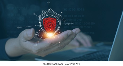 An advanced digital shield hovering above a hand, symbolizing cybersecurity, data protection, and digital security, highlighting network protection and the shield’s defensive strength.
