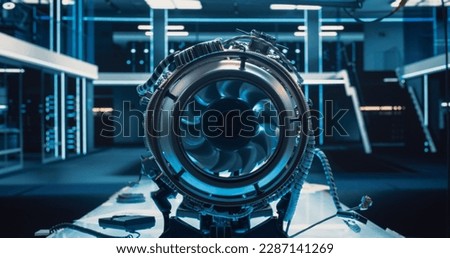 Advanced Futuristic Turbine Engine with a Moving Fan. Modern Industrial Jet Engine in Research and Development Facility. Zoom In Close Up on a Turbofan Engine