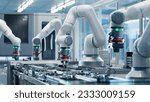 Advanced High Precision Robot Arm inside Bright Electronics Factory. Electronic Devices Production Industry. Component Installation on Circuit Board. Fully Automated Modern PCB Assembly Line.