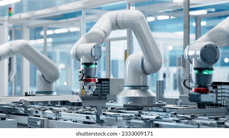 Advanced High Precision Robot Arm inside Bright Electronics Factory. Component Installation on Circuit Board. Electronic Devices Production Industry. Fully Automated Modern PCB Assembly Line. - Shutterstock ID 2333009171