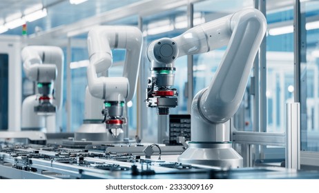 Advanced High Precision Robot Arms inside Bright Electronics Factory. Fully Automated Modern PCB Assembly Line. Electronic Devices Production Industry. Quality Control of Circuit Board - Powered by Shutterstock