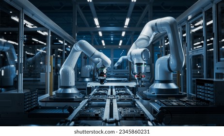 Advanced High Precision Robot Arms on Fully Automated PCB Assembly Line Inside Modern Electronics Factory. Electronic Devices Production Industry. Component Installation on Circuit Board - Shutterstock ID 2345860231
