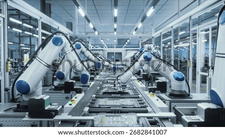 Advanced Microelectronics Manufacturing: AI Robotic Arms Assembling Circuit Boards on a Modern Production Line. Factory Floor is Automated. Robots Performing Mechanical Tasks with PCB Components