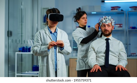 Advanced Neurological Scientist Using Medical Inovation In Lab Wearing Virtual Reality Glasses, Gesticulating. Team Of Researchers Working With Equipment Device, Future, Medicine, Healthcare, Vision