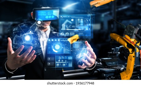 Advanced robot arm system for digital industry and factory robotic technology . Automation manufacturing robot controlled by industry engineering using IOT software connected to internet network . - Shutterstock ID 1936177948