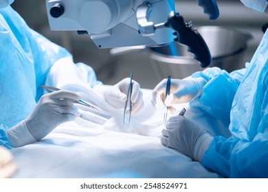 Advanced surgical team performs precise leg surgeries in modern hospital setting using microscope