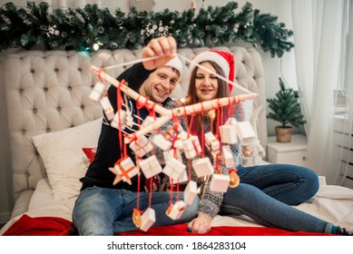 Advent Calendar In The Hands Of A Girl, A Surprise In A Box, Christmas Gifts.