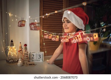 Advent Calendar Like Ski Lift On Mountain Resort. Kids Look At Funicular Cabin With Toilette Paper Roll. Zero Waste And Reusable Christmas. Magic Winter Holiday, Blurred Lights, Focus On Cable Car