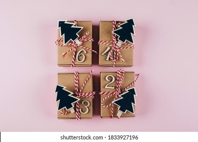 Advent christmas calendar. Wrapped gifts on pink background. Top view, flat lay - Powered by Shutterstock