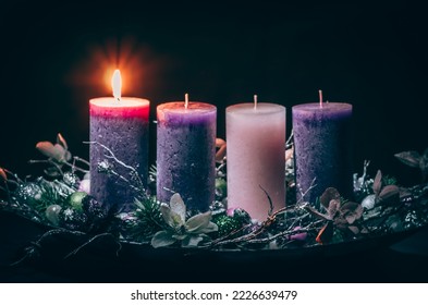 advent cristian concept with 1 pink candle and 3 purple candles