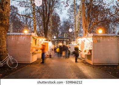 Advent Time In The Center Of Zagreb, Croatia, People Gathering In Zrinjevac Park With Food Stands, Blurred Motion, Unrecognizable People