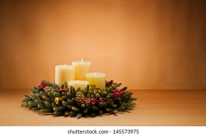 Advent wreath with burning candles for the pre Christmas time