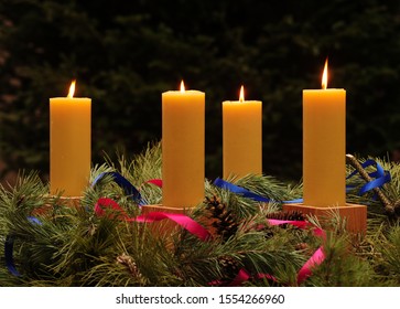 Advent wreath with four handmade beeswax candles, with four candles lit for Fourth Sunday of Advent; series of four photographs for Advent Season