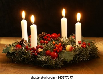 Advent wreath with silver ribbons.