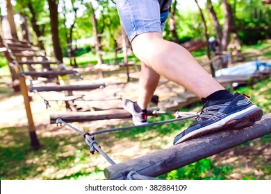 Adventure Climbing High Wire Park - People On Course In Mountain Helmet And Safety Equipment