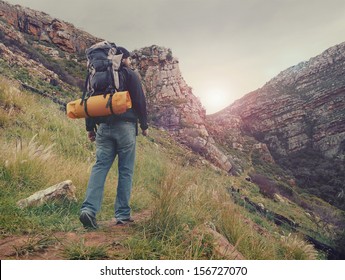 Adventure man hiking wilderness mountain with backpack, outdoor lifestyle survival vacation - Shutterstock ID 156727070