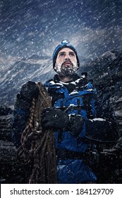 Adventure Mountain Man In Snow Expedition With Climbing Gear And Determination