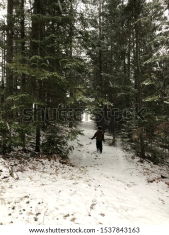 Similar – Image, Stock Photo Girl waiting at the side of the snowy mountain road looking down