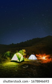 adventure travel from colourful of camping tent  on the mountain with soft focus star background in summer season
