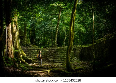 Adventure Travel In Jungle Ruins With Woman Traveller