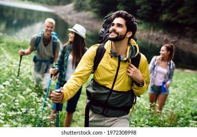Adventure, travel, tourism, hike and people concept. Group of happy friends with backpack outdoors - Powered by Shutterstock