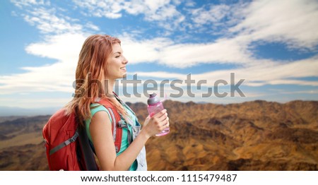 Similar – Image, Stock Photo Redheaded hiker with water bottle on nature getaway