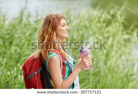 Similar – Image, Stock Photo Redheaded hiker with water bottle on nature getaway