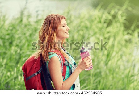 Similar – Image, Stock Photo Redheaded hiker with water bottle on nature getaway