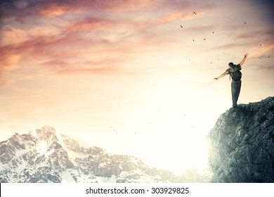 Adventurer Climber Reach The Top Of The Mountain