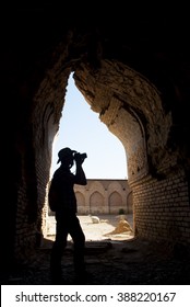 Adventurer (Indiana Jones Look) Photographer In The Old Destroyed Mosque, Bibi-Khanym, Samarkand, Uzbekistan. 