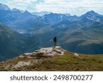 Adventurer Overlooking the Majestic Tignes Valley from Aiguille de la Grande Sassière