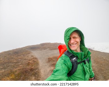 Adventurous Athletic Male Hiker Taking A Selfie On A Hiking Trail In Early Spring On A Cloudy Day In The Pacific Northwest.
