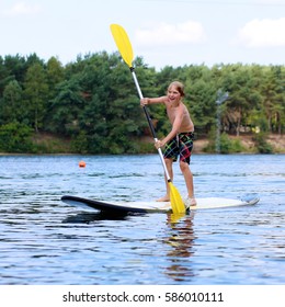 Adventurous Boy Learning Paddle On Stand Stock Photo 586010111 ...