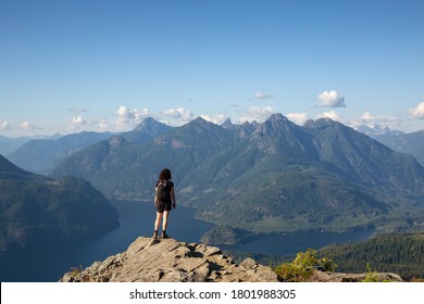 Adventurous Girl Hiking on top of Tin Hat Mountain, part of the popular Sunshine Coast Hiking Trail in Powell River, British Columbia, Canada. Concept: Explore, Adventure, Travel - Shutterstock ID 1801988305
