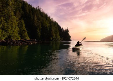 Adventurous Girl kayaking in the Pacific Ocean. Sunset Sky Art Render. Taken in San Josef Bay, Cape Scott, Northern Vancouver Island, British Columbia, Canada. Adventure Travel Concept
