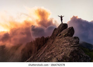 Adventurous Girl on top of a rugged rocky mountain. Dramatic Colorful Sunrise Sky Art Render. Taken on Crown Mountain, North Vancouver, BC, Canada. - Shutterstock ID 1864742578