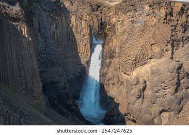 An adventurous hike through East Iceland leads to the stunning Hengifoss and Litlanesfoss waterfalls, surrounded by striking basalt columns and rugged landscapes - Powered by Shutterstock